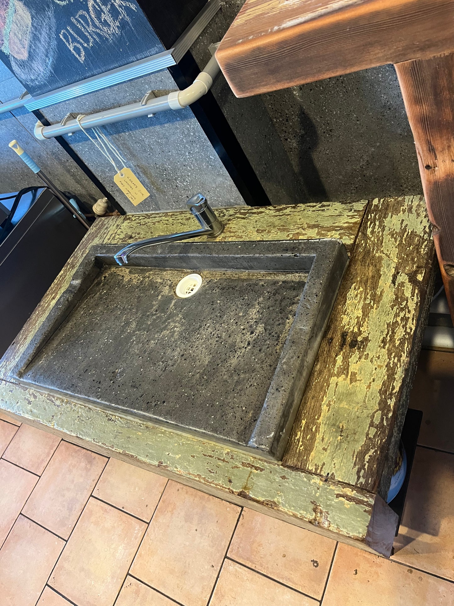 Concrete sink with distressed timber surround