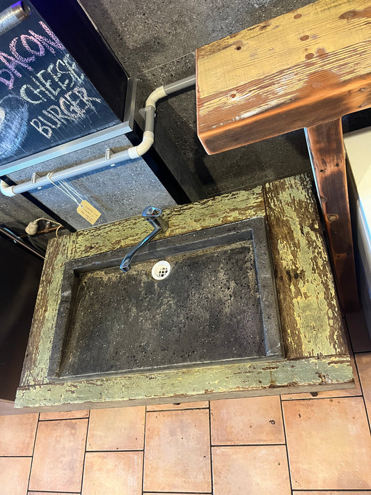 Concrete sink with distressed timber surround