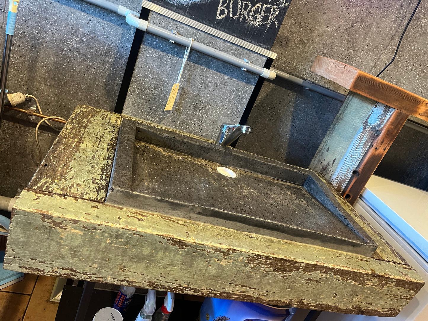 Concrete sink with distressed timber surround